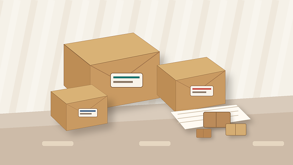 Custom printed mailer boxes and ecommerce packaging inserts arranged on a packing table.